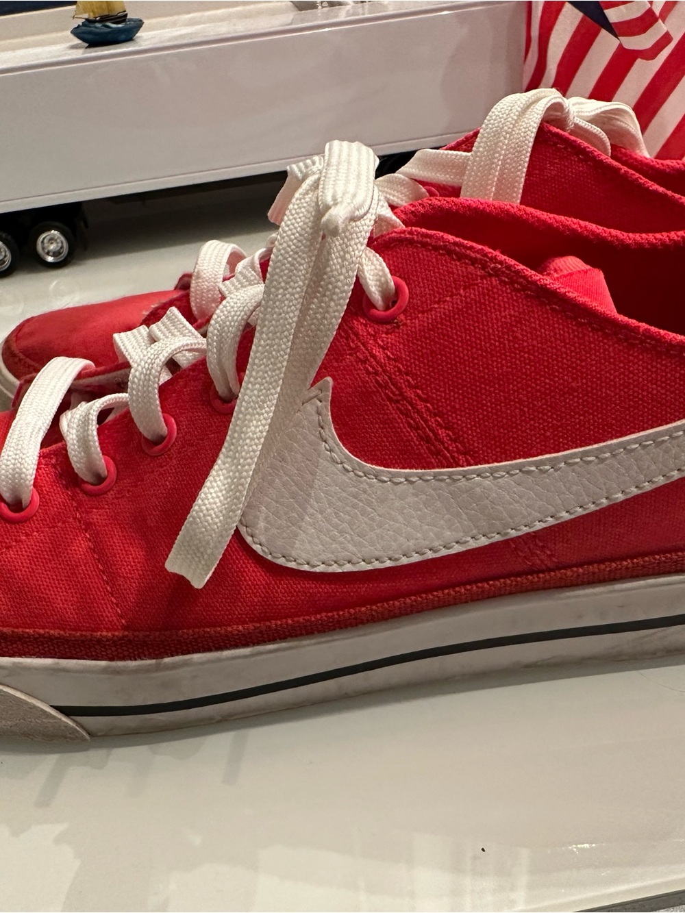 Nike Women’s Red Canvas Sneakers with White Swoosh